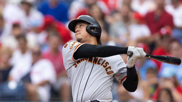 SF Giants first baseman Wilmer Flores hits a home run during the first inning against the Philadelphia Phillies at Citizens Bank Park on August 23, 2023.
